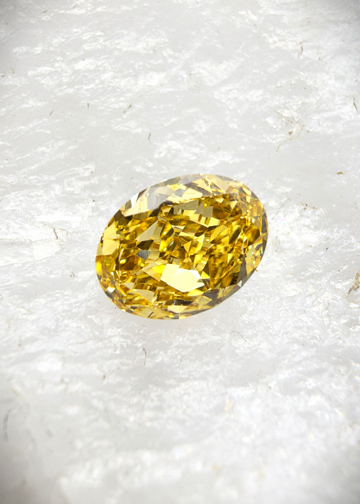 0.48CT Diamond: VS Fancy Intense Yellow Orange Oval Cut