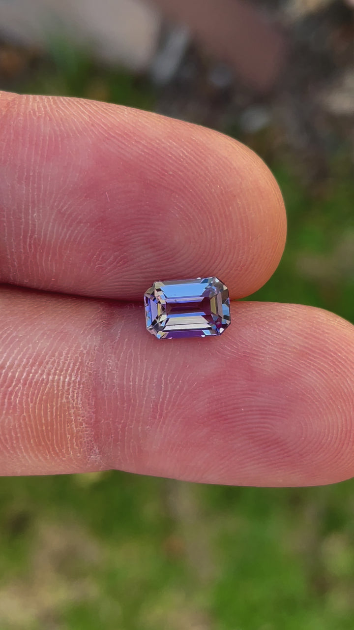 Detailed Video of a Precision Emerald Cut Tanzanite Gemstone in Teal Blue and Purple Colors, Weighing 1.70 Carats, with Dimensions 8.49 x 5.85 x 3.98 mm, from Merelani Hills, Arusha Region, Tanzania - No Treatment