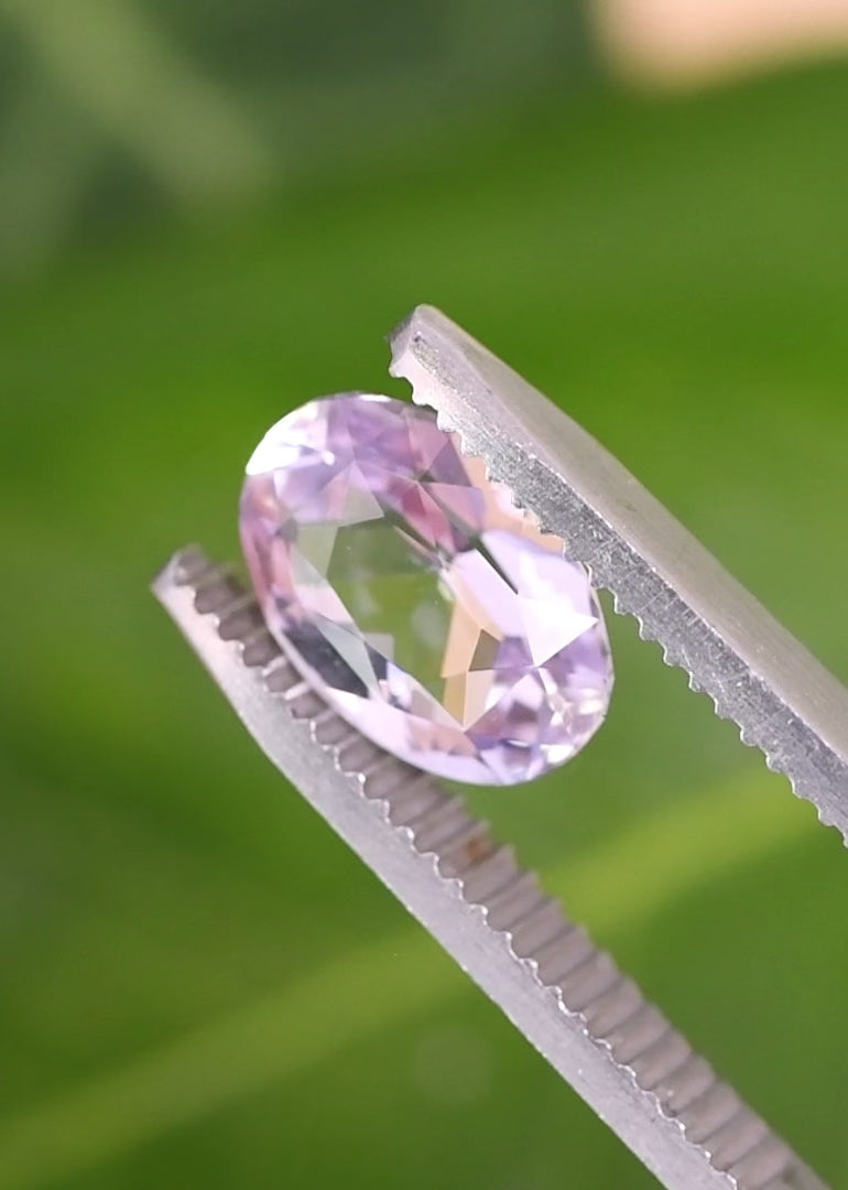 otating loose lavender pink purple sapphire from Sakaraha Madagascar showing the brilliance and color play of the precision oval mixed cut in light.