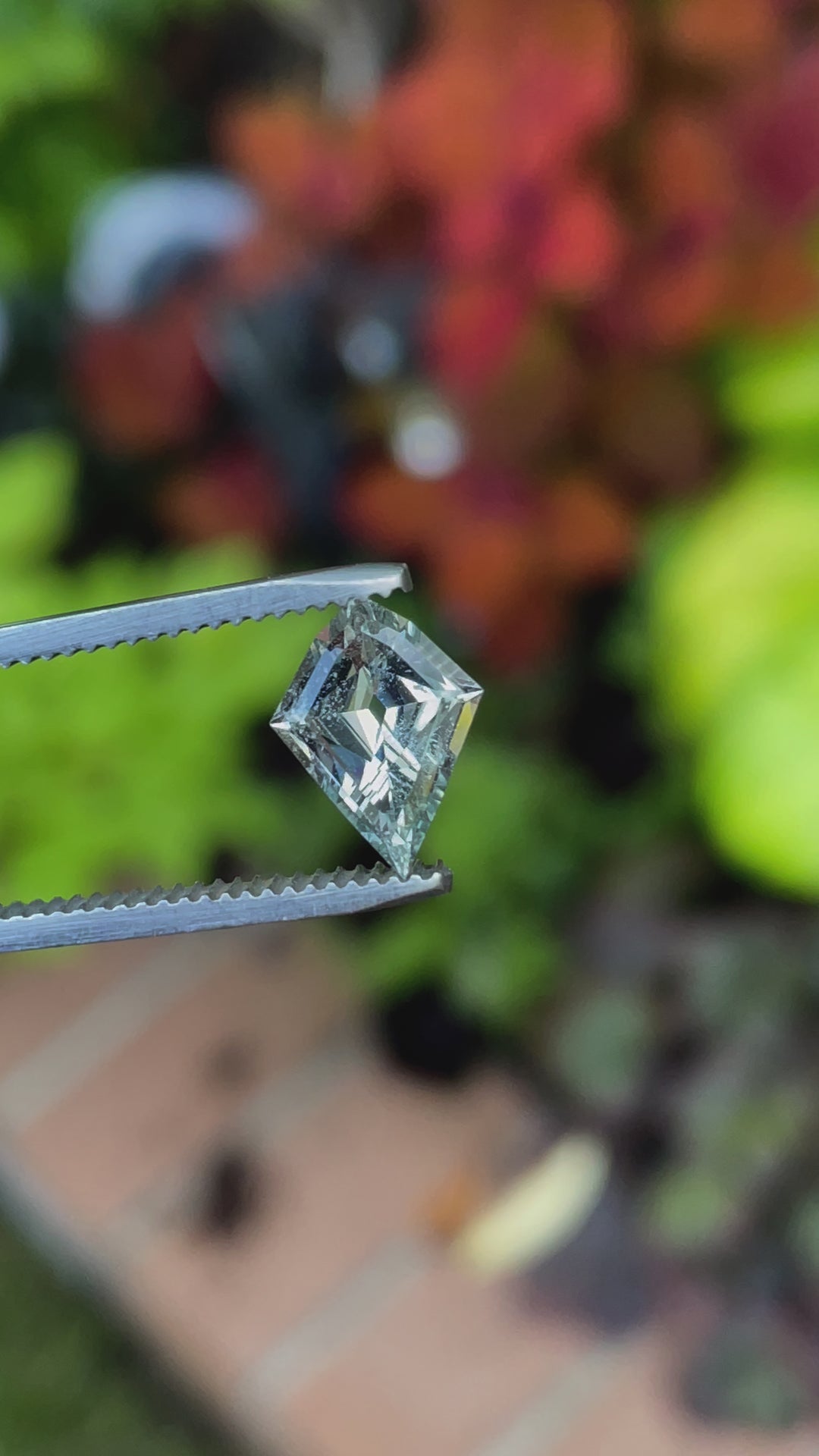 A geometric modified step cut kite sapphire with a beautiful seafoam green hue, ethically sourced from Sri Lanka, weighing 2.28 carats and untreated for natural brilliance.