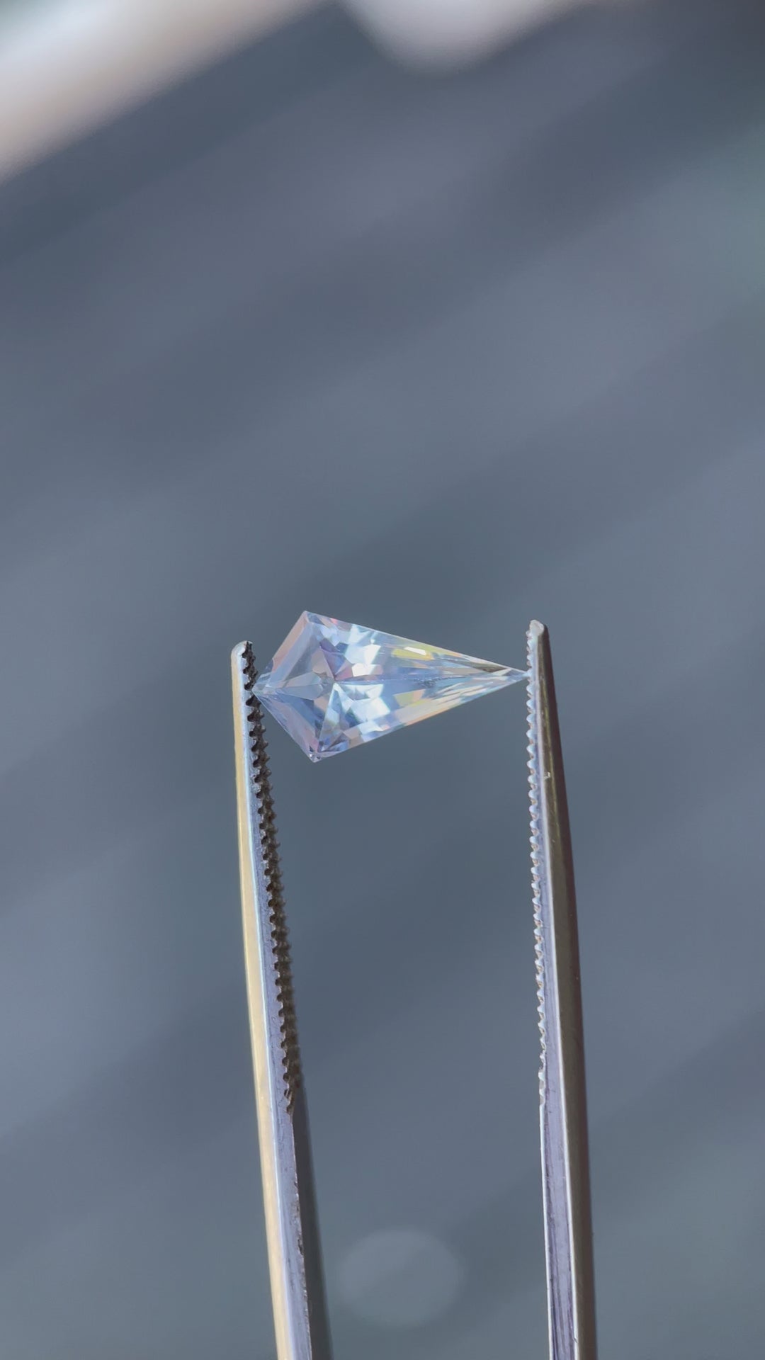 Interactive exploration of a 1.66 carat periwinkle and powder blue sapphire, showing off its natural, untreated state and geometric precision.