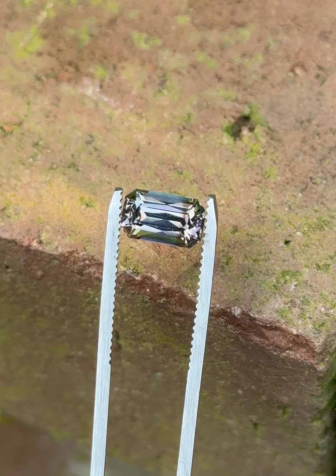 Close-up video of unheated 2.32 carat tanzanite from Merelani Hills, showing dynamic grey-blue-green color play in radiant cut