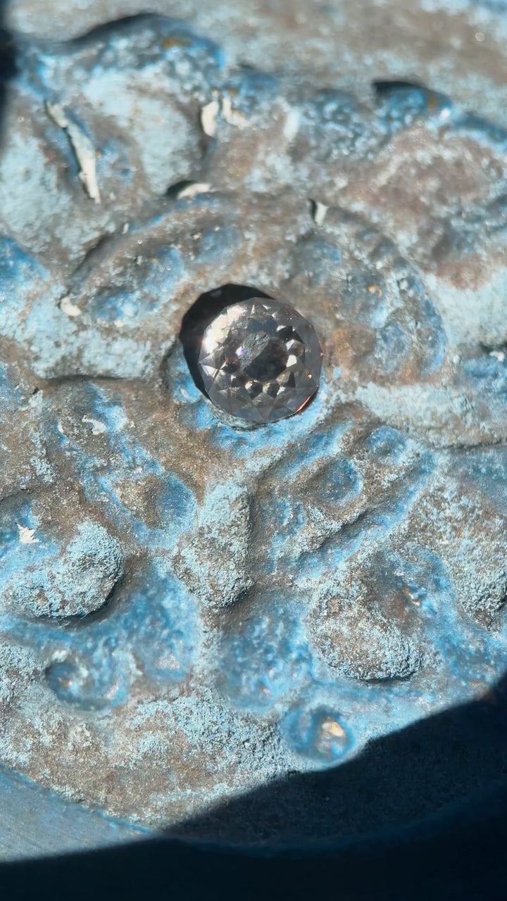 Video of a 0.77 carat Fancy Light Brown C3–C4 Mughal cut diamond rotating under mixed lighting to reveal its VVS2 clarity, concave Mughal facets, and very strong blue fluorescence; natural untreated diamond from South Africa.