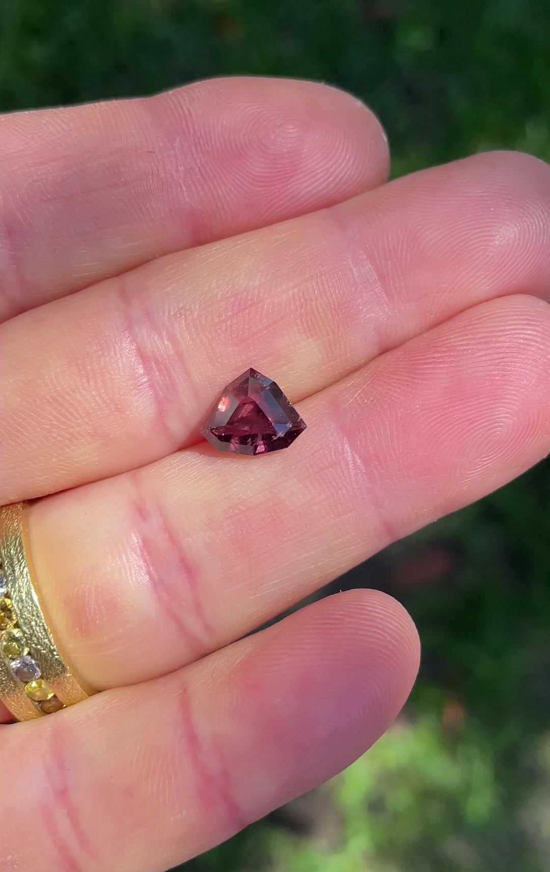 Close-up motion clip of a 2.94ct untreated sapphire from Umba River in a custom shield cut, showing depth of color and angular brilliance as the light plays across each facet.
