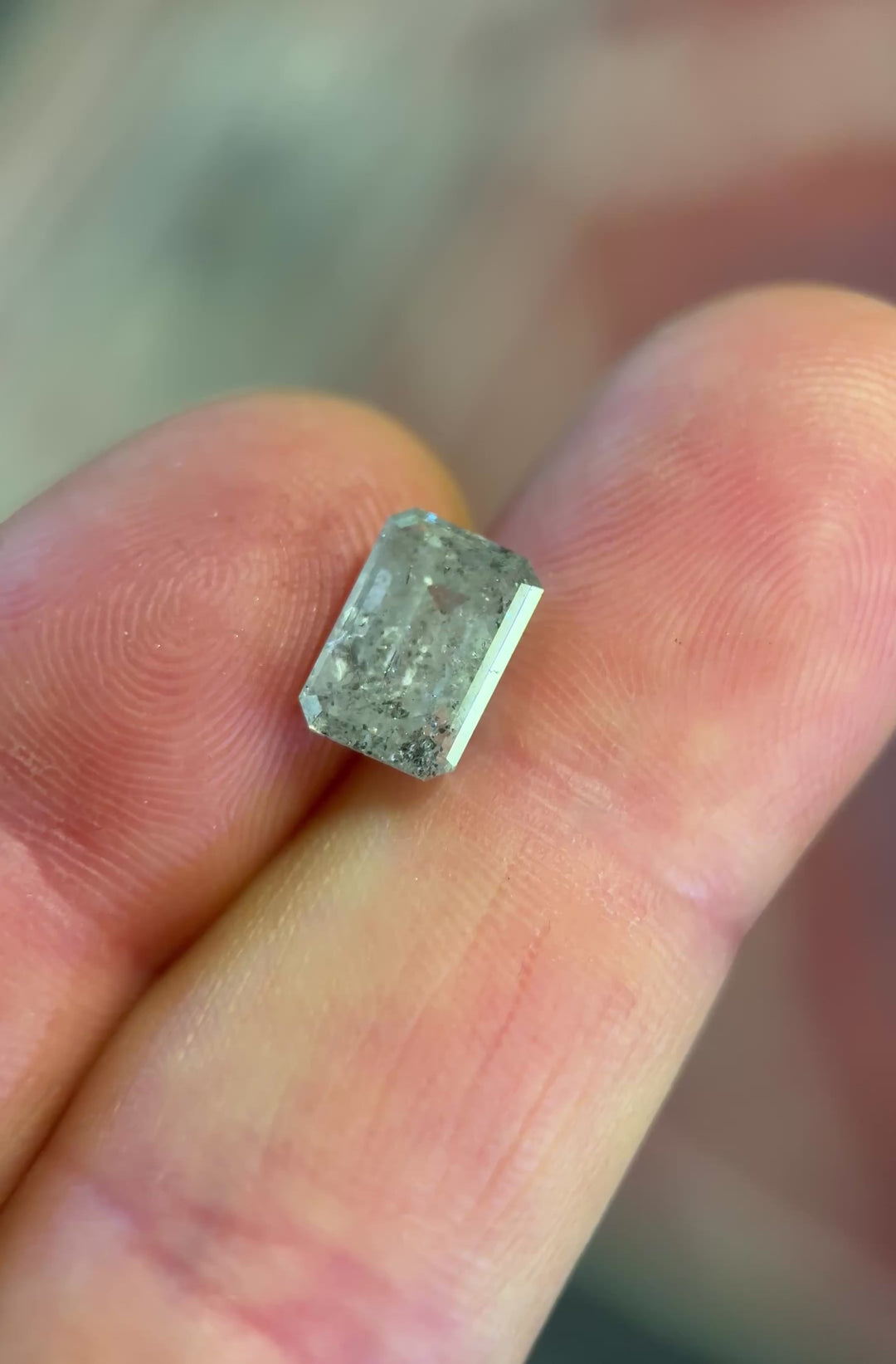 hand video of a 2.81CT Diamond: Salt and Pepper Emerald Cut

