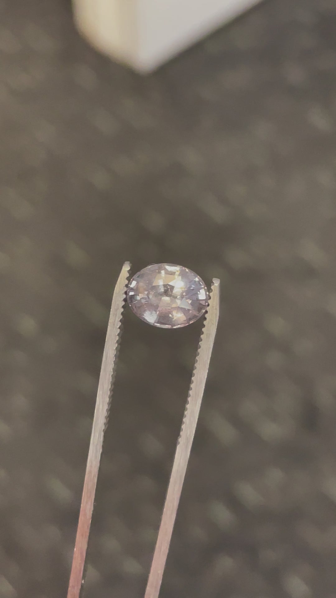 Interactive video presenting the captivating color transformation of a 3.19 carat sapphire from teal to seafoam, under natural light, emphasizing its alluring brilliance and flawless cut.
