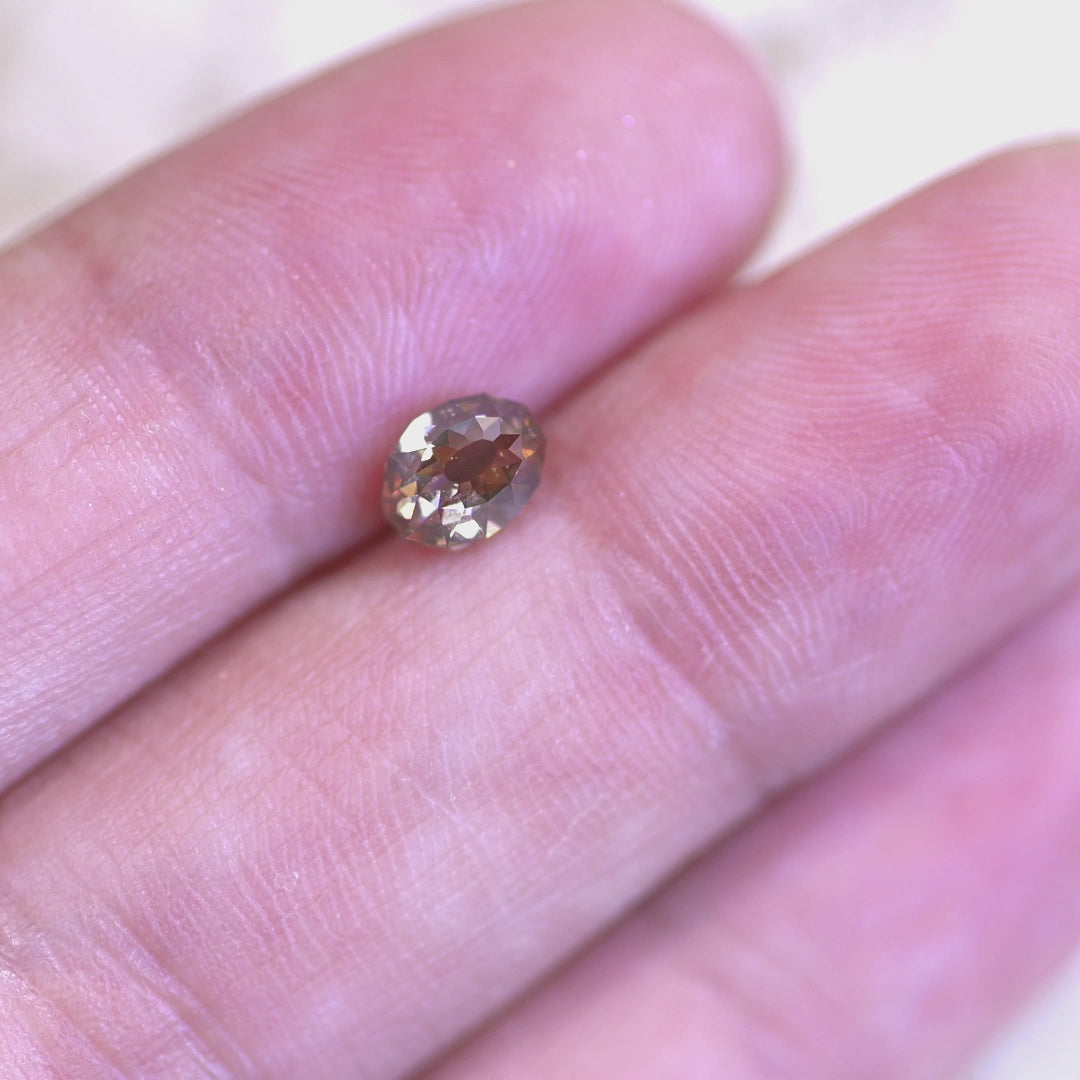 Rotating loose fancy light brown champagne Mughal cut diamond from South Africa, revealing its geometric faceting and warm brilliance in changing light.
