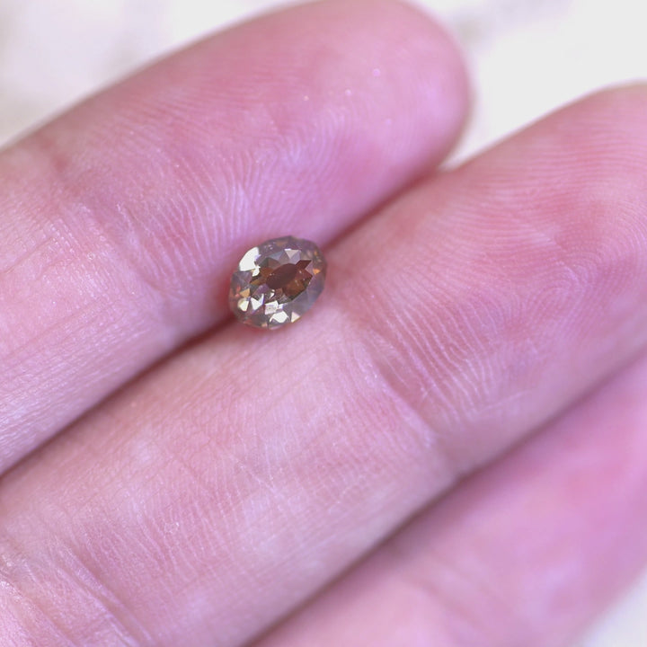 Rotating loose fancy light brown champagne Mughal cut diamond from South Africa, revealing its geometric faceting and warm brilliance in changing light.