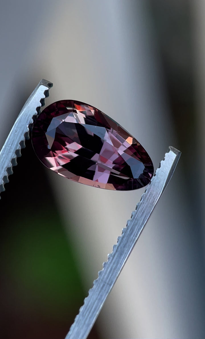 A close-up video showcasing the pear brilliant cut of a 3.09-carat color-change sapphire, revealing its stunning hues and exceptional clarity.
