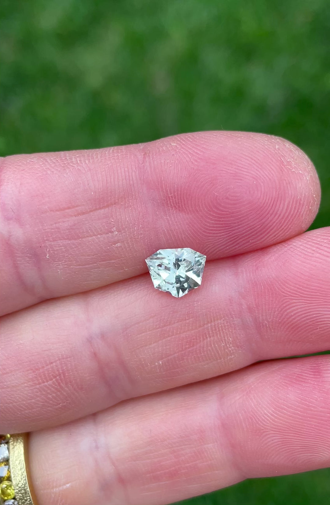 Close-up video showcasing brilliance and step facets of a 1.80 carat trillion brilliant sapphire from Malawi.