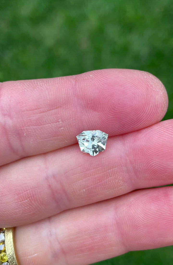 Close-up video showcasing brilliance and step facets of a 1.80 carat trillion brilliant sapphire from Malawi.