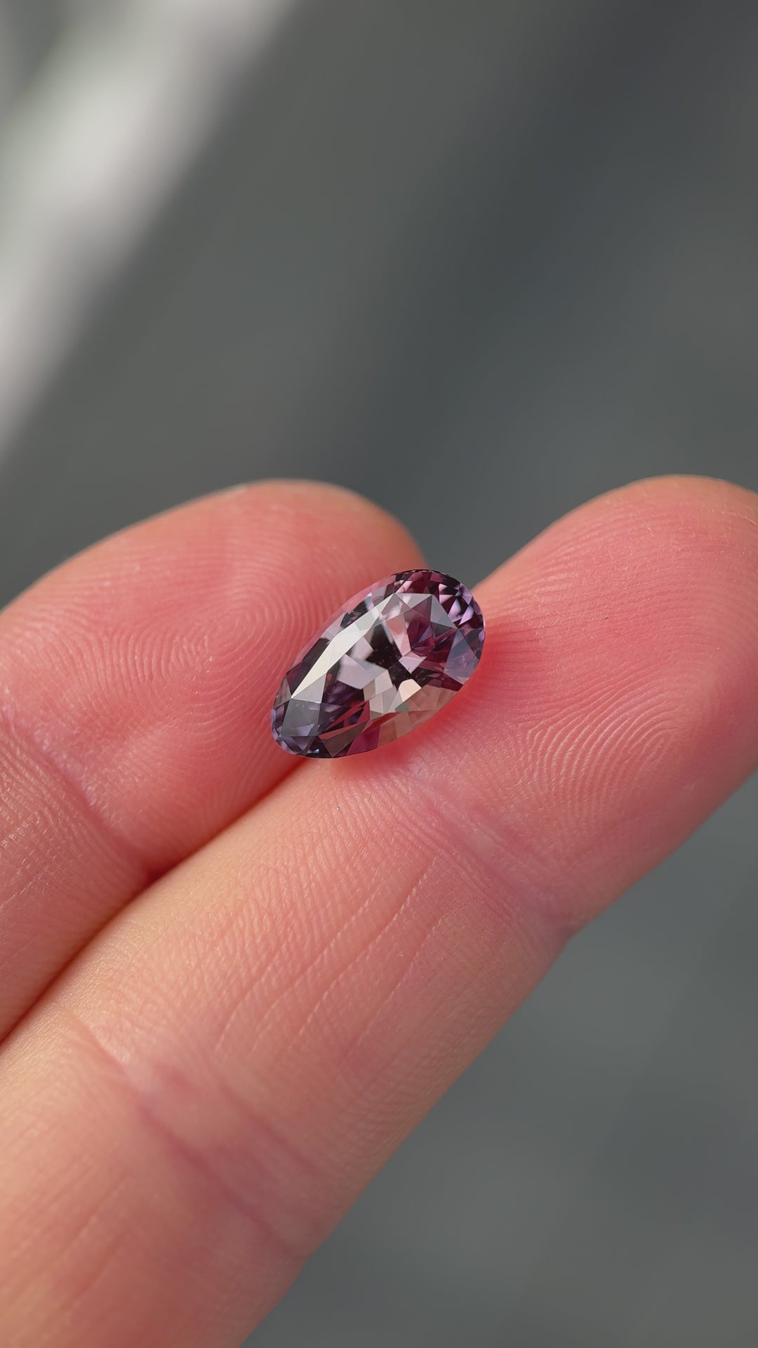 Rotating loose 5.33 carat sapphire from Sakaraha, Madagascar showing purplish red to peach champagne color change in a modified brilliant pear cut.
