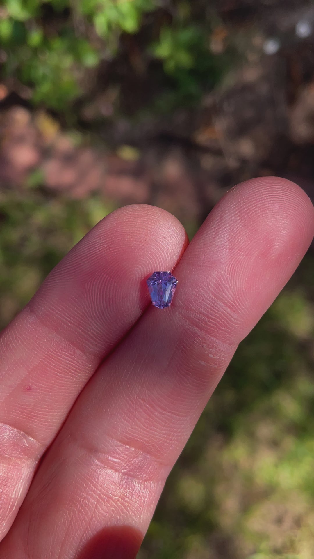 Engaging video highlighting the unique facets and multicolored brilliance of a 1.14 carat pink, lavender, and blue sapphire, demonstrating its aesthetic appeal and geometric precision.