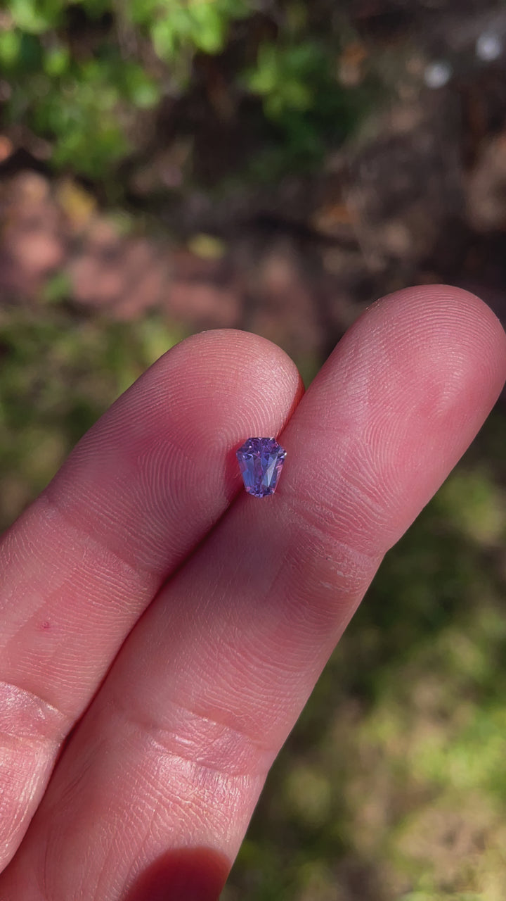 Engaging video highlighting the unique facets and multicolored brilliance of a 1.14 carat pink, lavender, and blue sapphire, demonstrating its aesthetic appeal and geometric precision.