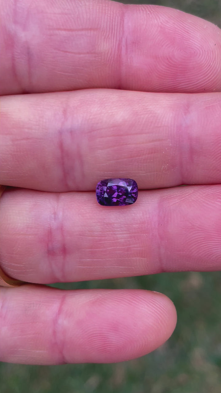 A comprehensive video of a 1.75-carat pink and mulberry sapphire in mix cushion cut, presenting a detailed 360-degree view. The video captures the gemstone's intense color saturation and natural brilliance, showcasing the beauty of this untreated Luc Yen sapphire.
