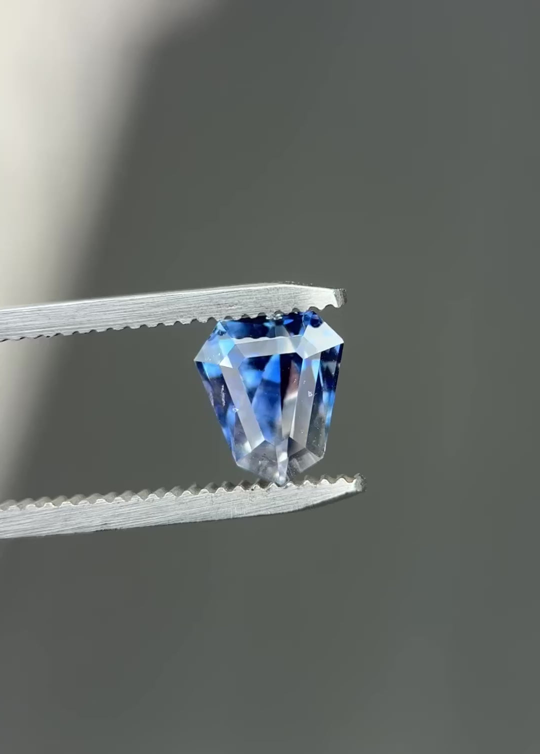 2.42CT Sapphire: Vibid Blue And Colorless Parti Custom Geo Shield Step Cut