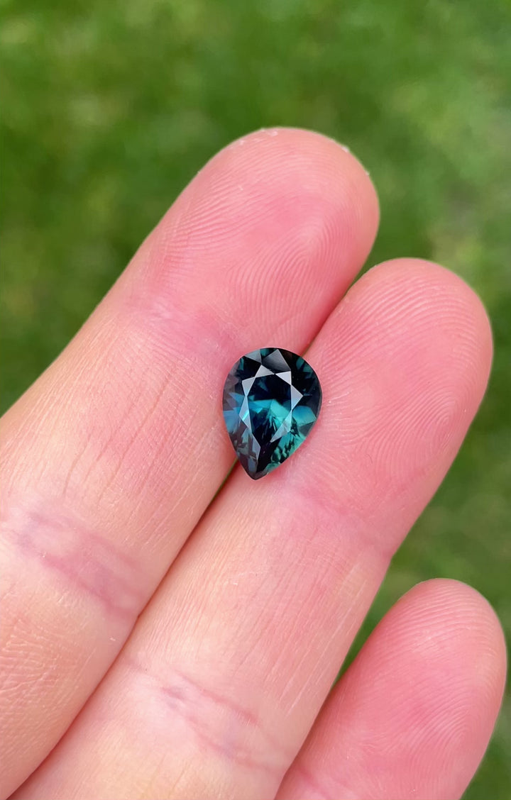 Video showcasing the 4.20 carat pear cut sapphire from Gombe, Nigeria, in motion to reveal its green, teal, and blue brilliance.