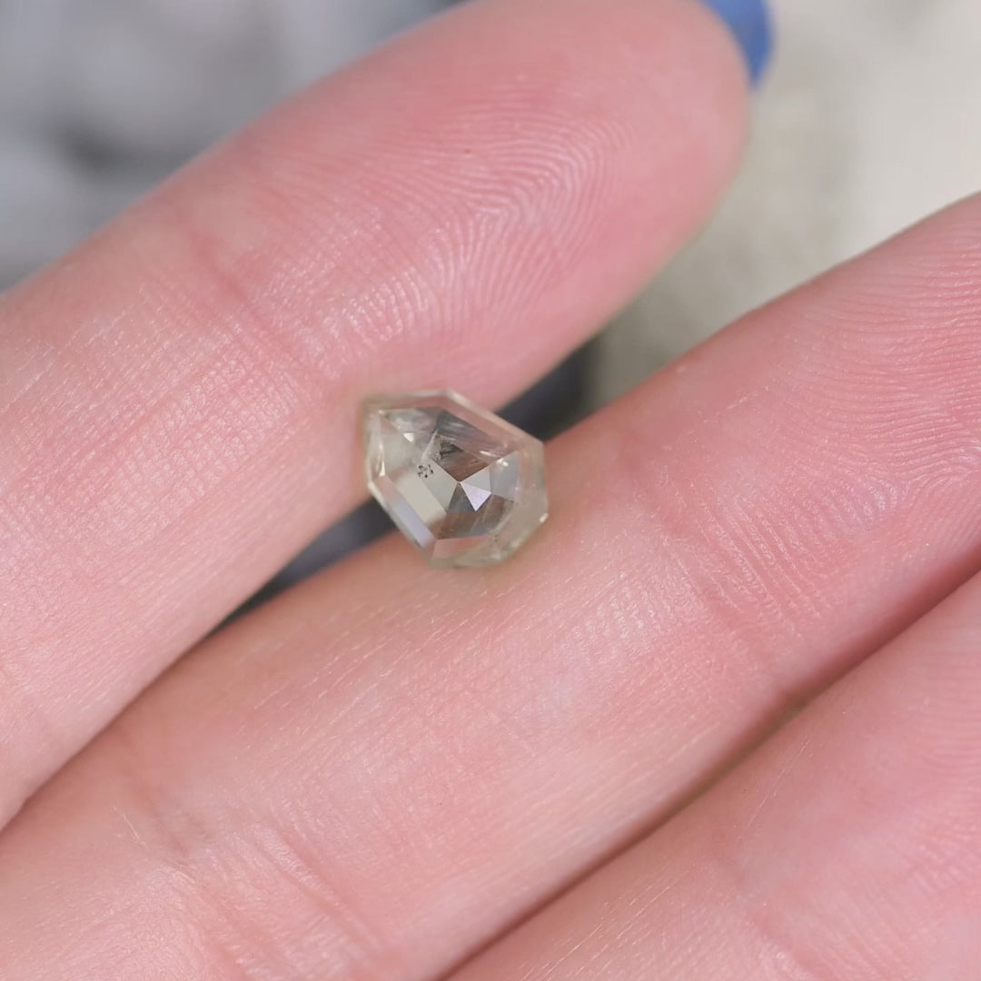 Rotating 1.82CT untreated Montana sapphire in teal and seafoam hues, custom shield rose cut gemstone shown in motion to highlight brilliance and faceting.