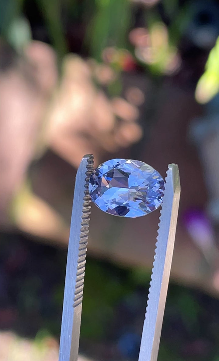 Video showing 360-degree rotation of a 3.03 carat oval brilliant cut sapphire with lavender, pink, and purple hues from Madagascar.