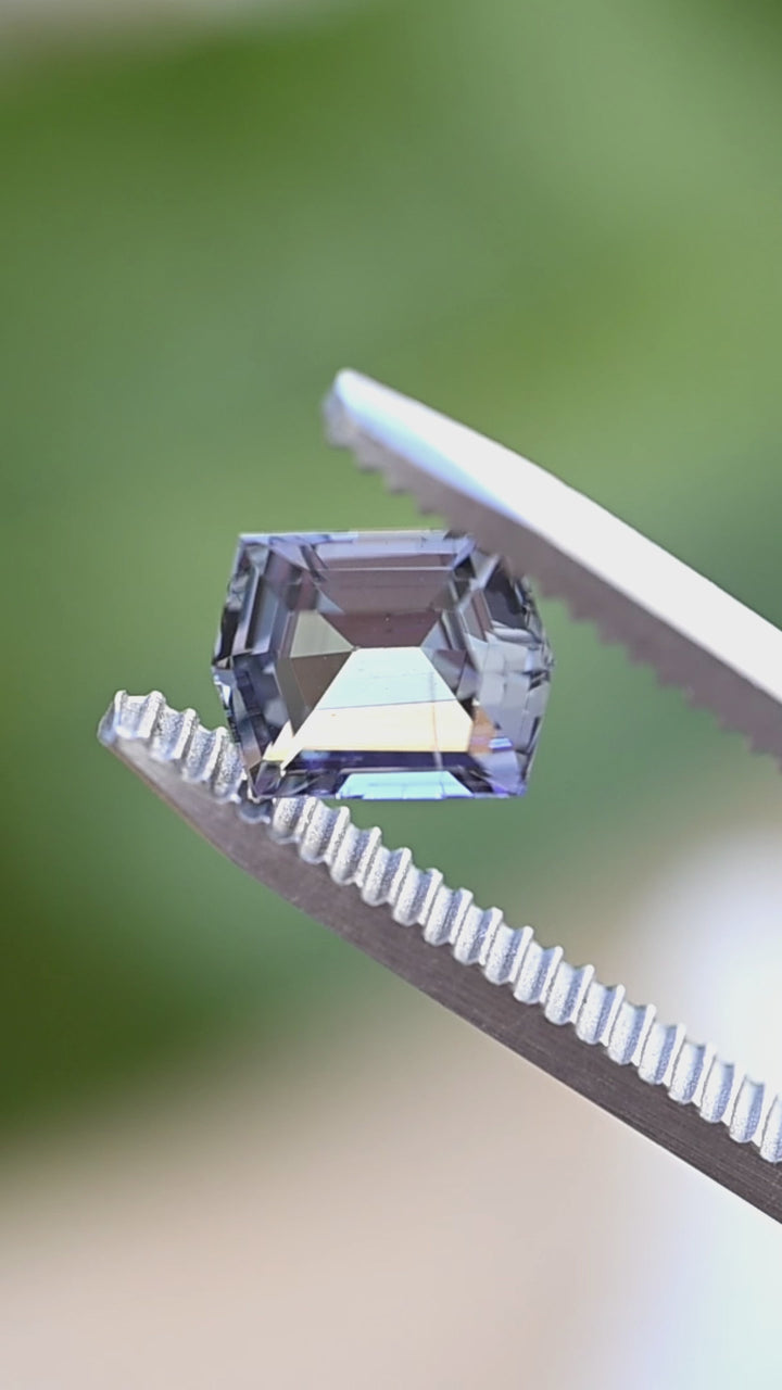 Watch this untreated 1.53 carat Merelani Hills tanzanite rotate in natural light, revealing elegant transitions between blue, green, and violet through its precision geometric step cut.