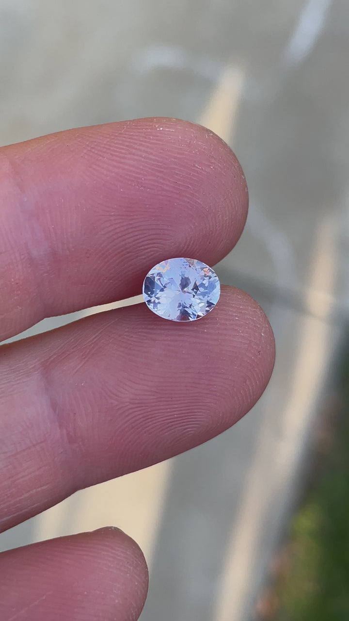 Macro video of oval cut 1.60ct Sri Lankan sapphire with glowing opalescent pastel colors and natural brilliance