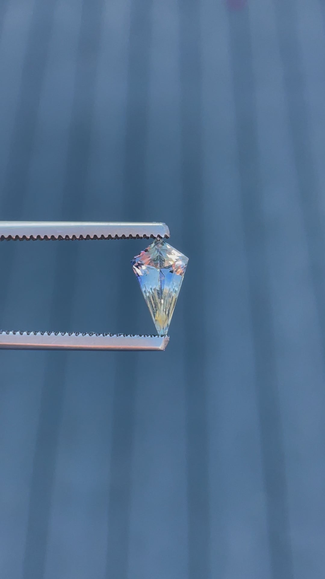 Engaging video highlighting the stunning facets and unique color blend of a 1.20 carat sapphire, demonstrating its cut and clarity against a soft background.