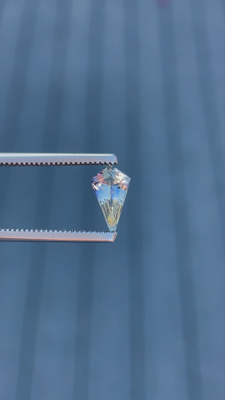 Engaging video highlighting the stunning facets and unique color blend of a 1.20 carat sapphire, demonstrating its cut and clarity against a soft background.