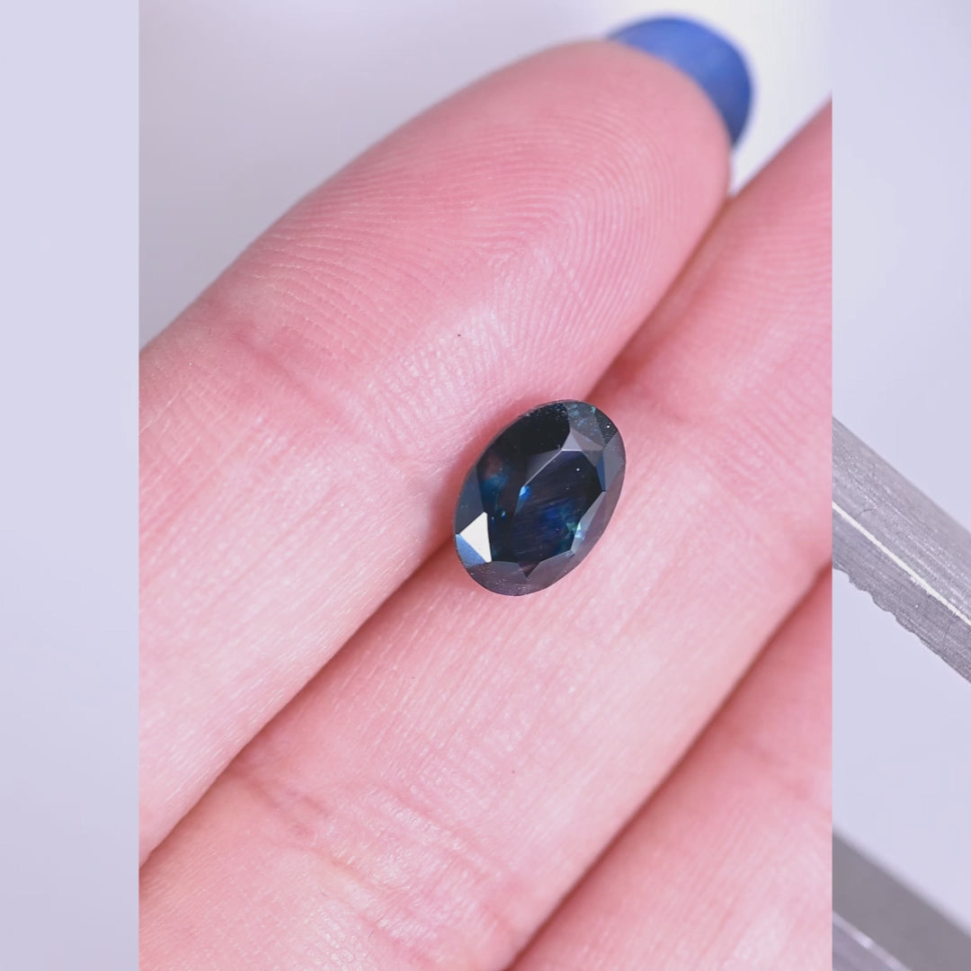 2.62ct heated blue Montana sapphire oval mix cut rotating under natural light, showing deep royal blue color shift and brilliance from El Dorado Bar Deposit