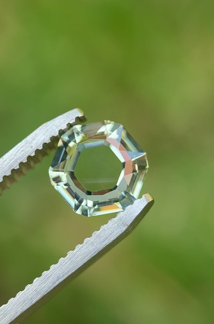 Rotating view of 2.09ct unheated Montana sapphire in light teal, custom hexagon portrait cut.
