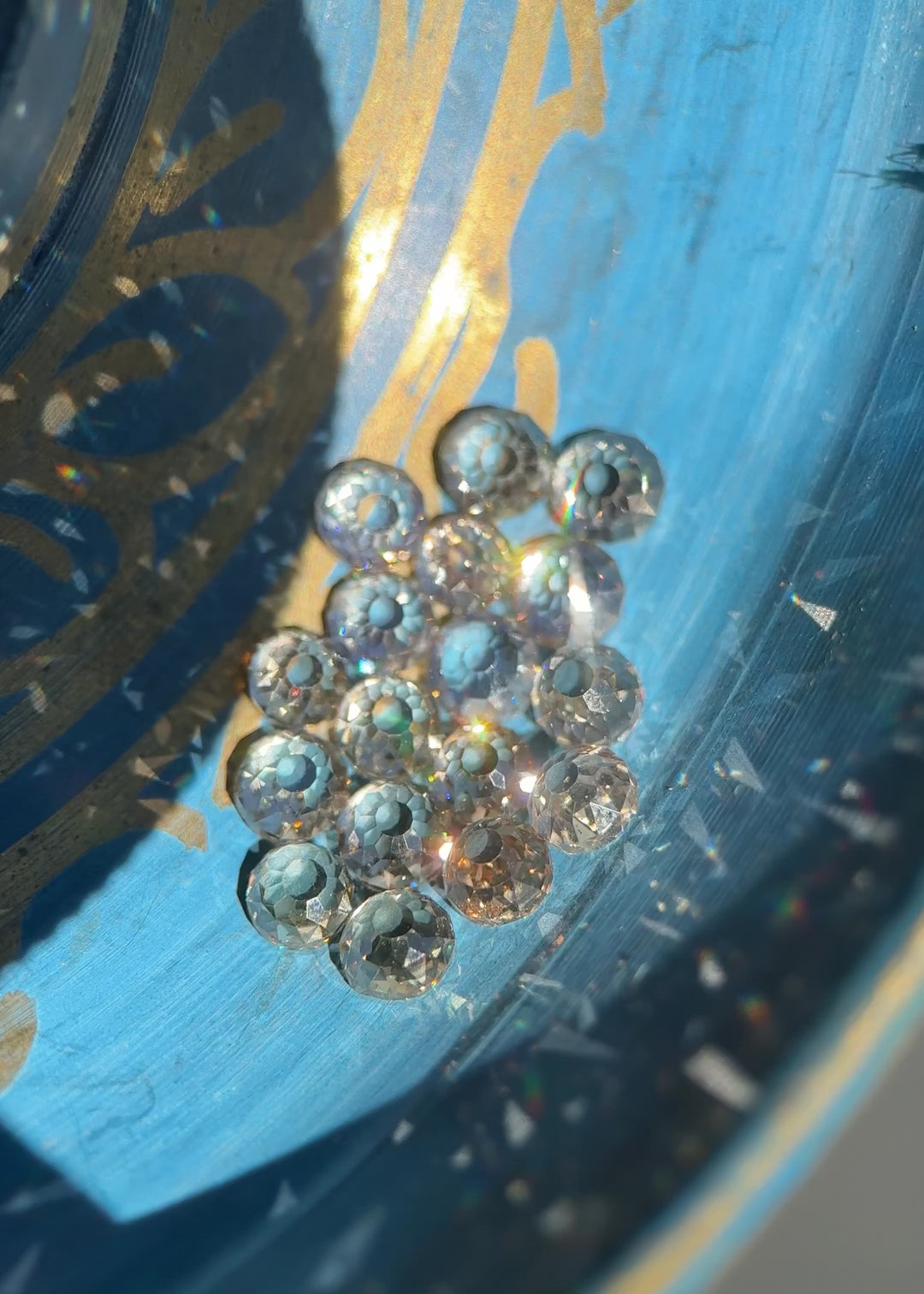 Video rotating a 5.20 carat Mughal cut diamond parcel under changing light, showing antique faceting, fancy light brown color, VVS clarity, and subtle blue fluorescence from South Africa