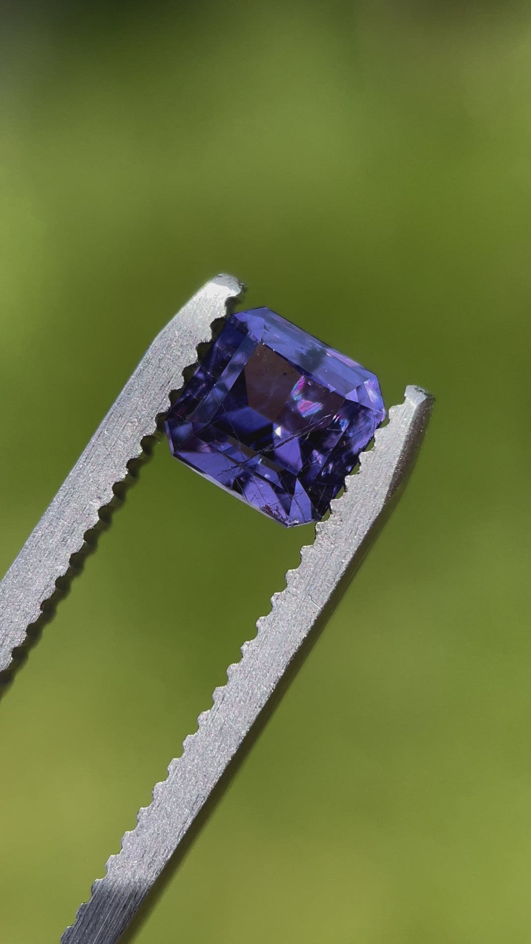 A 1.68 carat violet sapphire in a custom octagonal step cut from Umba River, Tanzania. Unheated and vibrant, showcasing its brilliance and clarity.