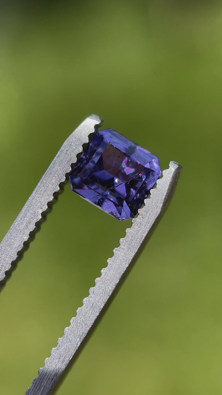 A 1.68 carat violet sapphire in a custom octagonal step cut from Umba River, Tanzania. Unheated and vibrant, showcasing its brilliance and clarity.