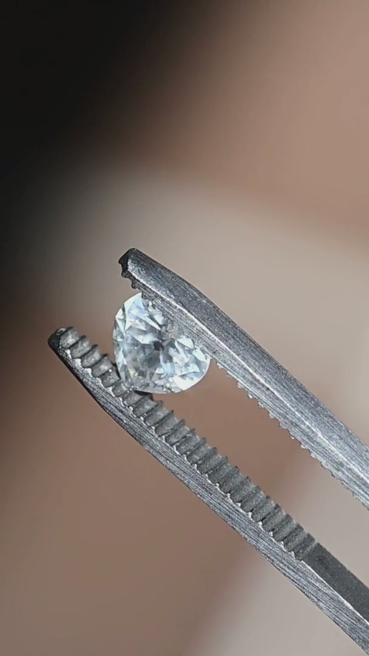 Experience the timeless beauty of this untreated 0.87 carat white diamond from South Africa. Its antique style heart cut produces elegant broad flashes of brilliance, making it a beautiful choice for a custom engagement ring, pendant, or heirloom jewelry design.