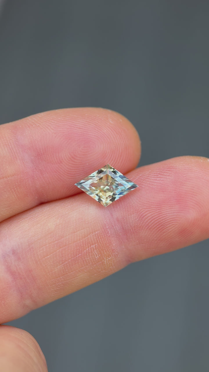 Handheld video of a Madagascar parti sapphire, 3.07 carats, showing detailed brilliance and precise faceting in lozenge cut