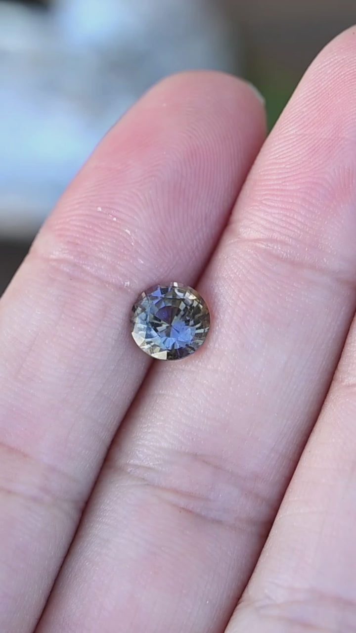 Experience the dynamic pleochroism of this untreated Merelani tanzanite as its custom round faceting reveals shifting blue, purple, teal, green, and amber tones from every angle.
