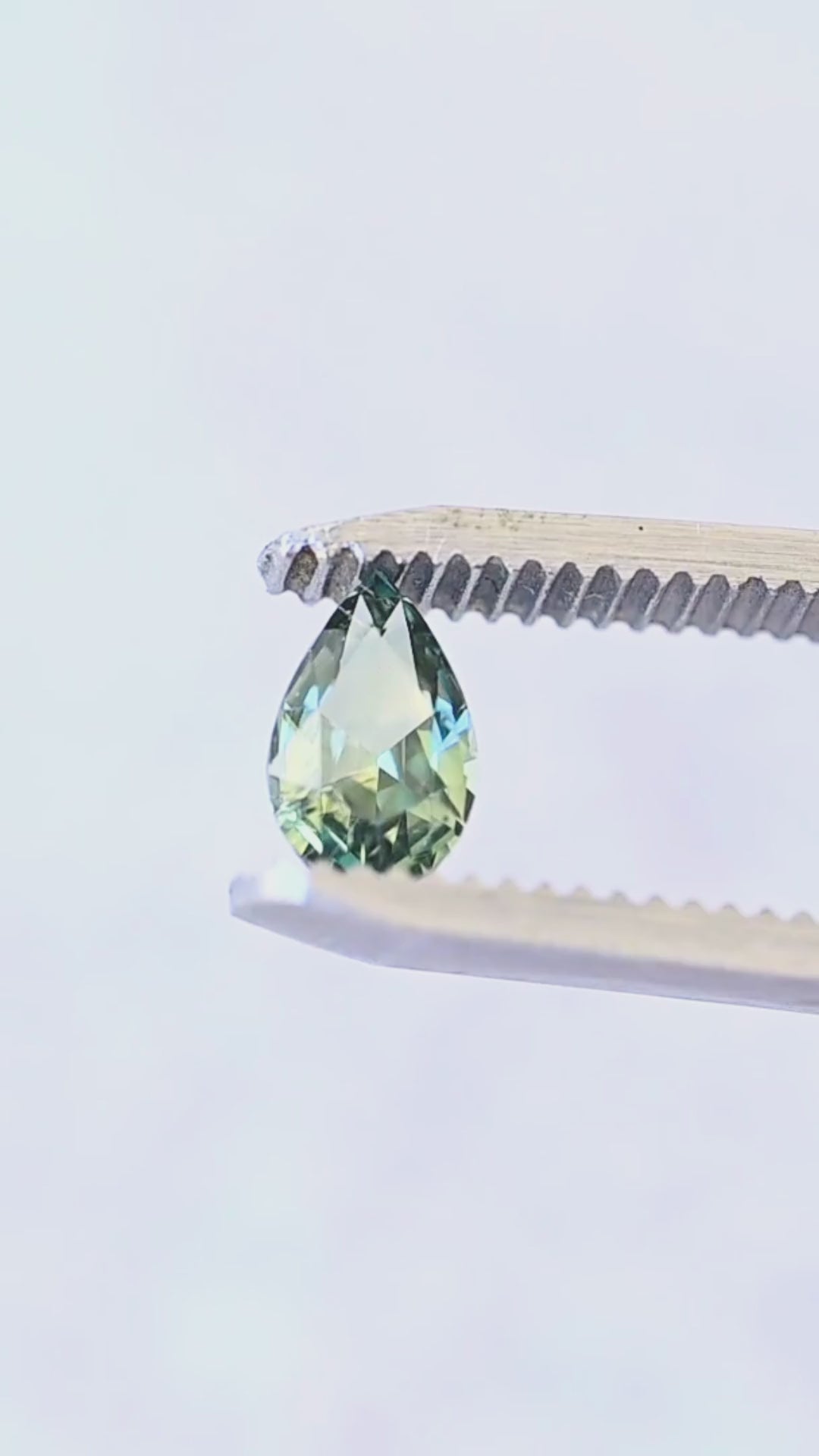 A closer look at the precision faceting and blue-green reflections of this heated 1.01ct pear-shaped Madagascar sapphire.