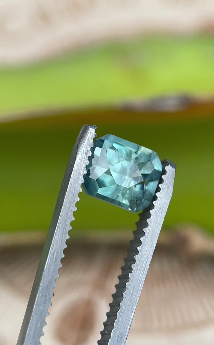 Rotating video of a 1.86 carat unheated sapphire from Montana, highlighting its teal blue and green color play in a custom octagonal cut.