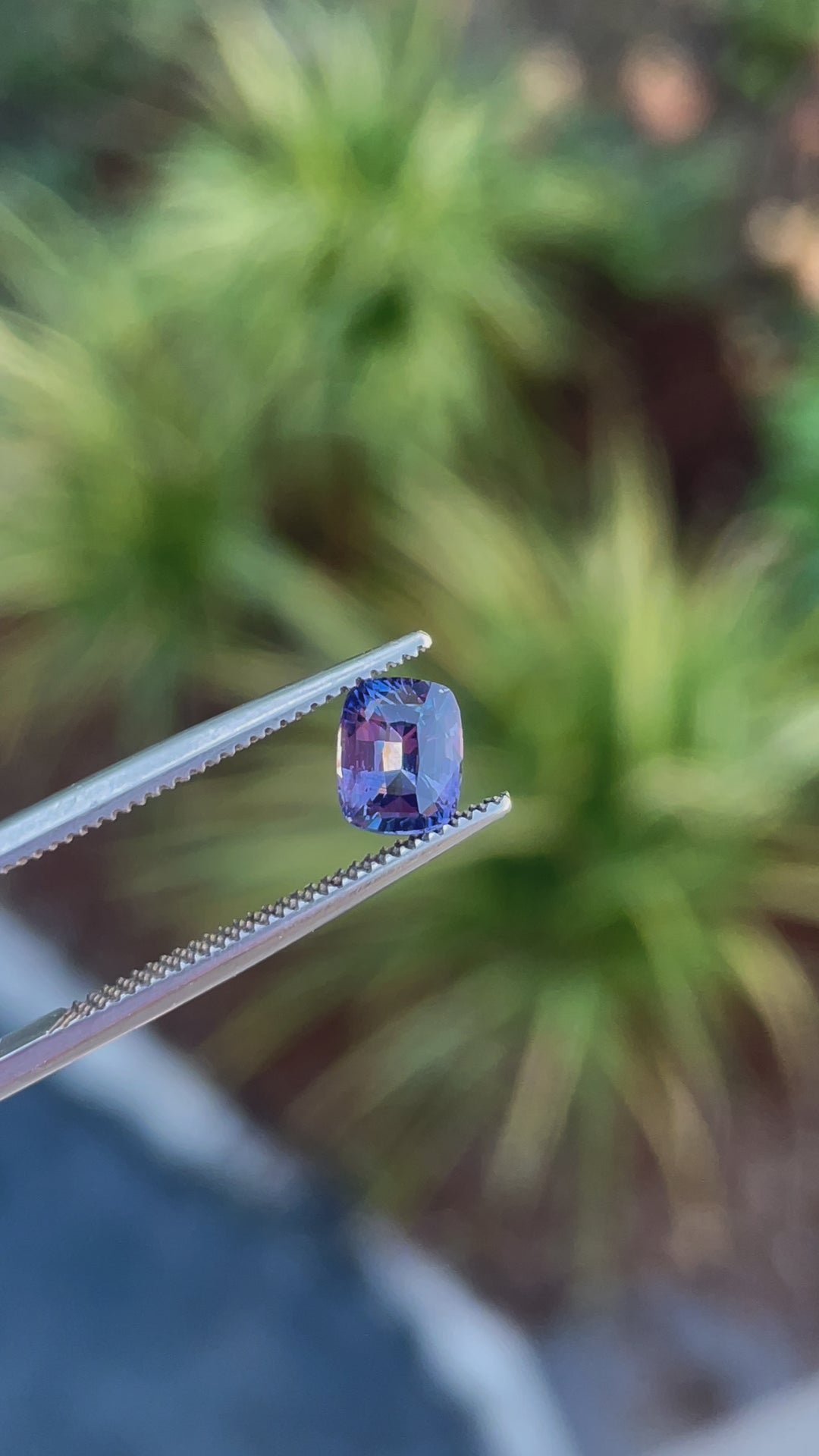 360-degree video showcasing a 1.05 carat sapphire gemstone with a radiant cut, opalescent purple to pink hues, and untreated clarity, from Sri Lanka.