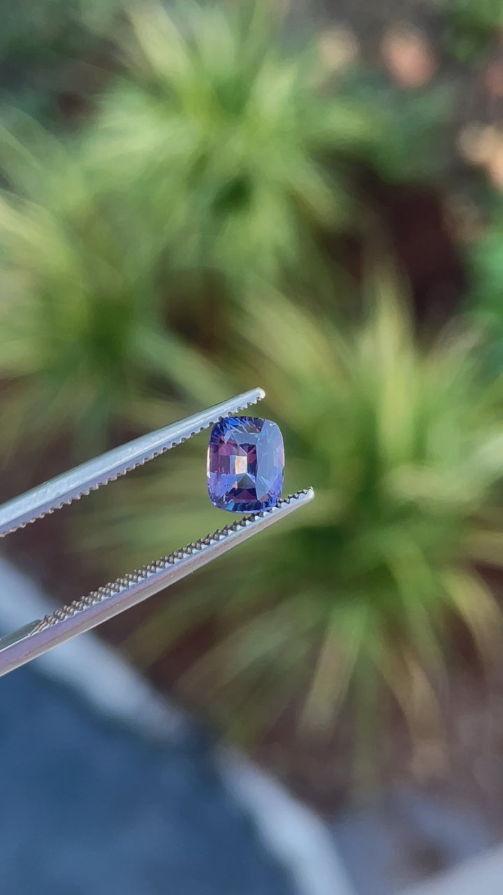 360-degree video showcasing a 1.05 carat sapphire gemstone with a radiant cut, opalescent purple to pink hues, and untreated clarity, from Sri Lanka.