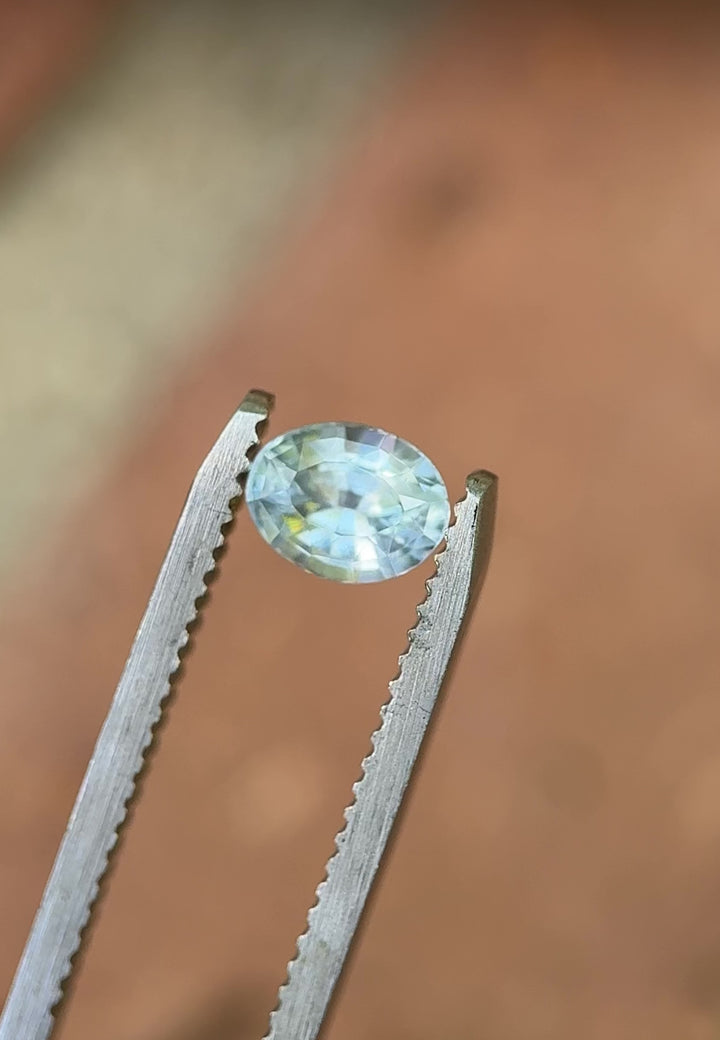 360-degree view of unheated oval-cut Montana sapphire with soft blue and teal shimmer