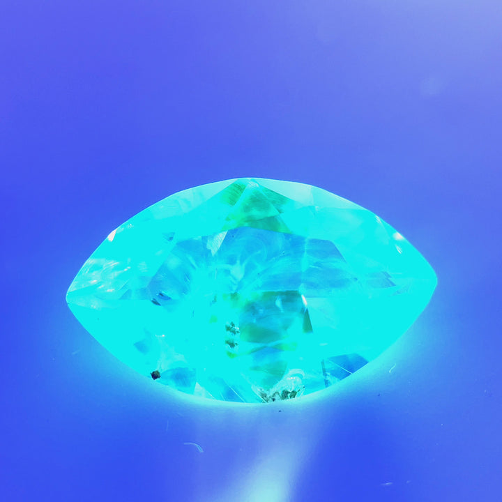 A video showing the fluorescence of the 2.18ct Hyalite Opal under UV light, revealing its vivid green glow.