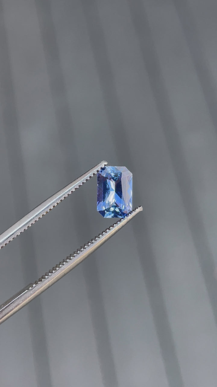 Video showcasing a 1.10 carat sapphire gemstone, radiant cut with blue-lavender hues, untreated and from Sri Lanka.