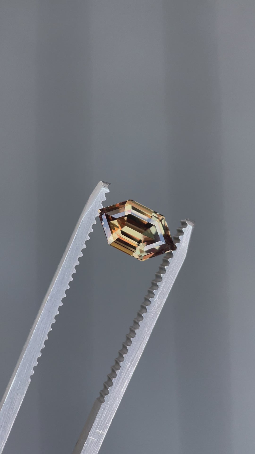 A close-up video of a rare 1.22-carat sapphire from Songea, Tanzania, highlighting its precision-cut hexagonal shape and dynamic color shifts from different angles.
