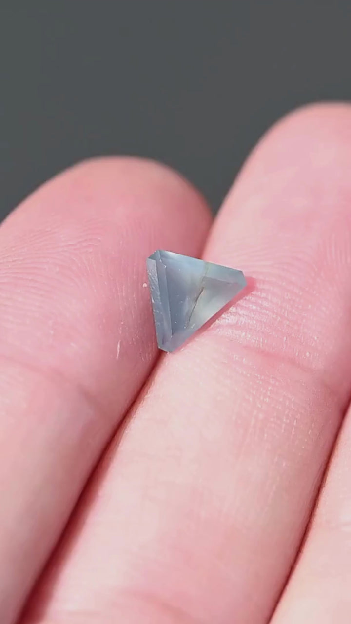 Explore the scale, softly diffused greenish blue color and natural internal character of this untreated 1.15ct precision trillion cut sapphire from Gombe, Nigeria.