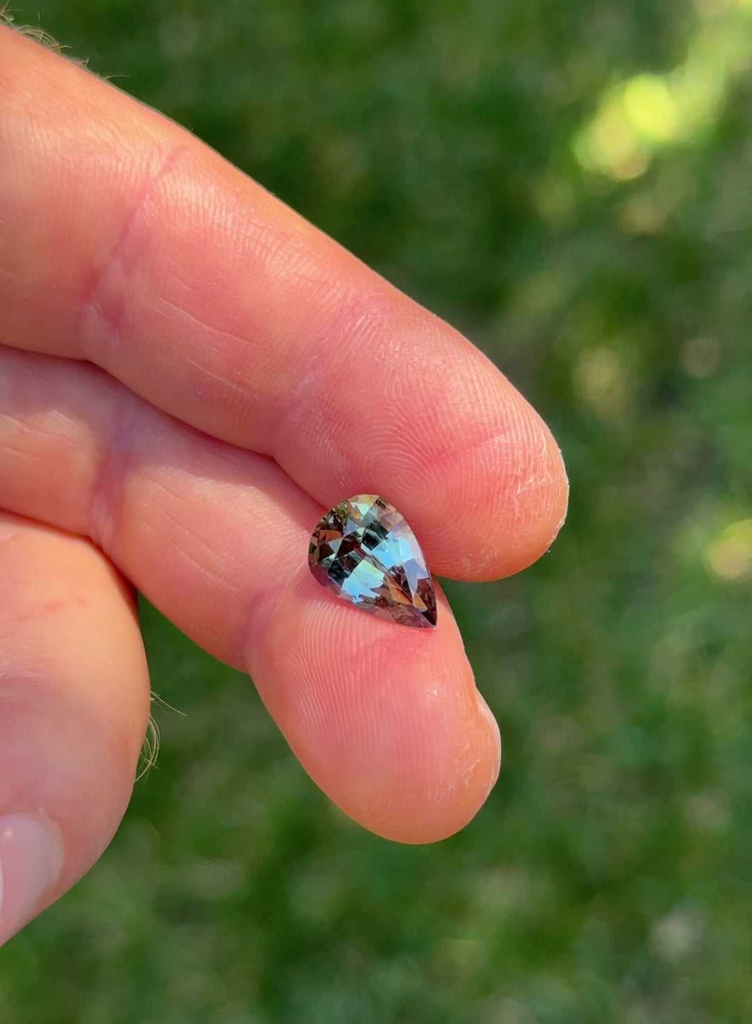 Video of 3.80ct Tanzanite gemstone rotating in natural light to reveal pear cut and dynamic mermaid color play