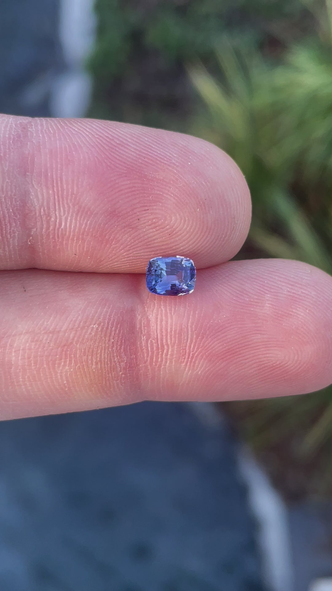 Video of a 1.05 carat radiant cut sapphire gemstone from Sri Lanka, featuring an opalescent purple to pink color and natural untreated brilliance.