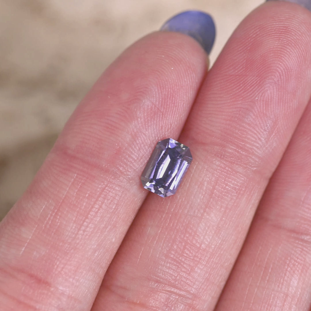 Rotating loose purple, blue, and green tanzanite from Merelani Hills showing the brilliance and color shift of the custom modified radiant cut.