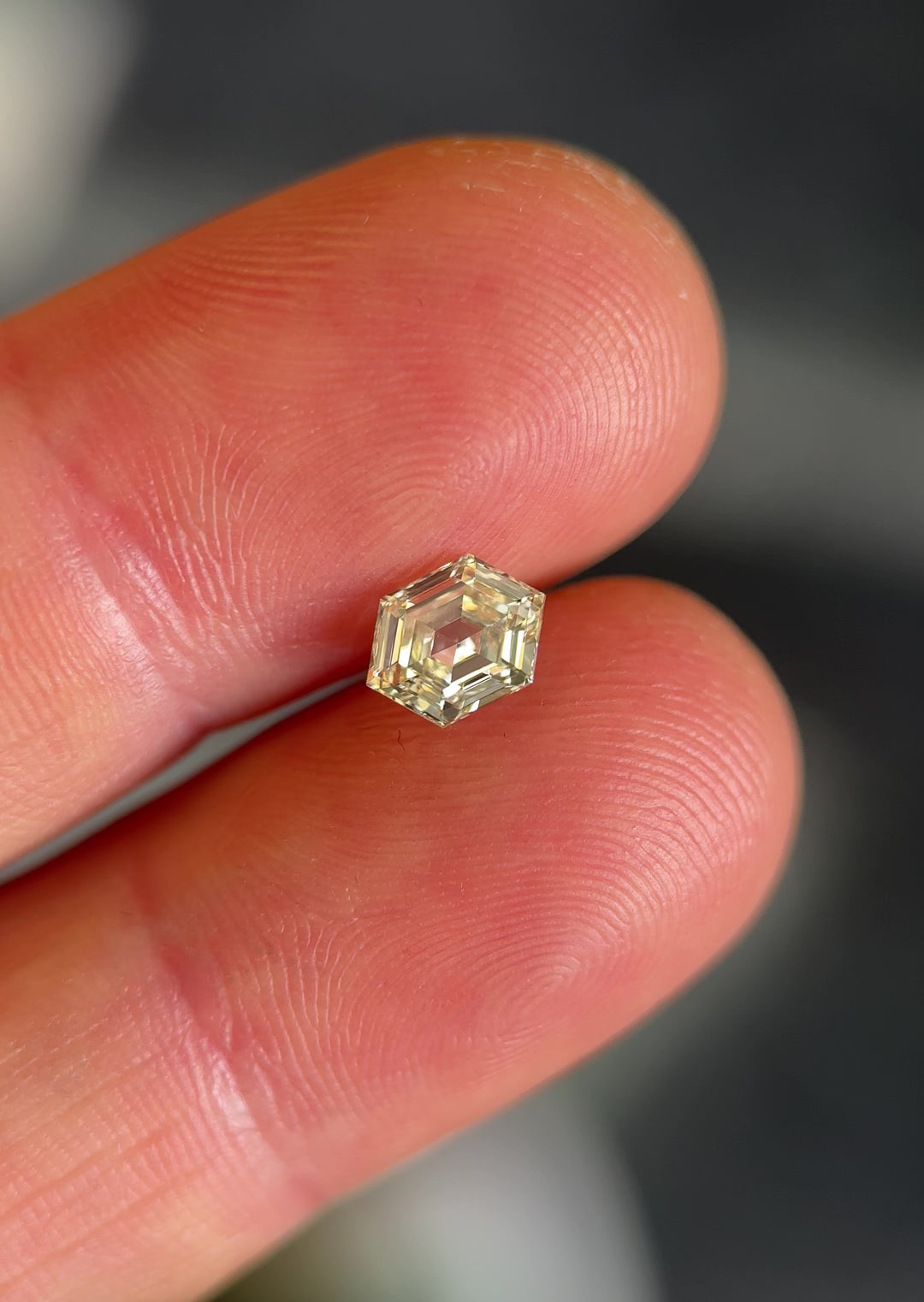 Macro video of a 1.01 carat hexagonal step cut diamond from Gahcho Kué, Canada, showcasing its O–P color grade, exceptional VVS2 clarity, and untreated natural sparkle.
