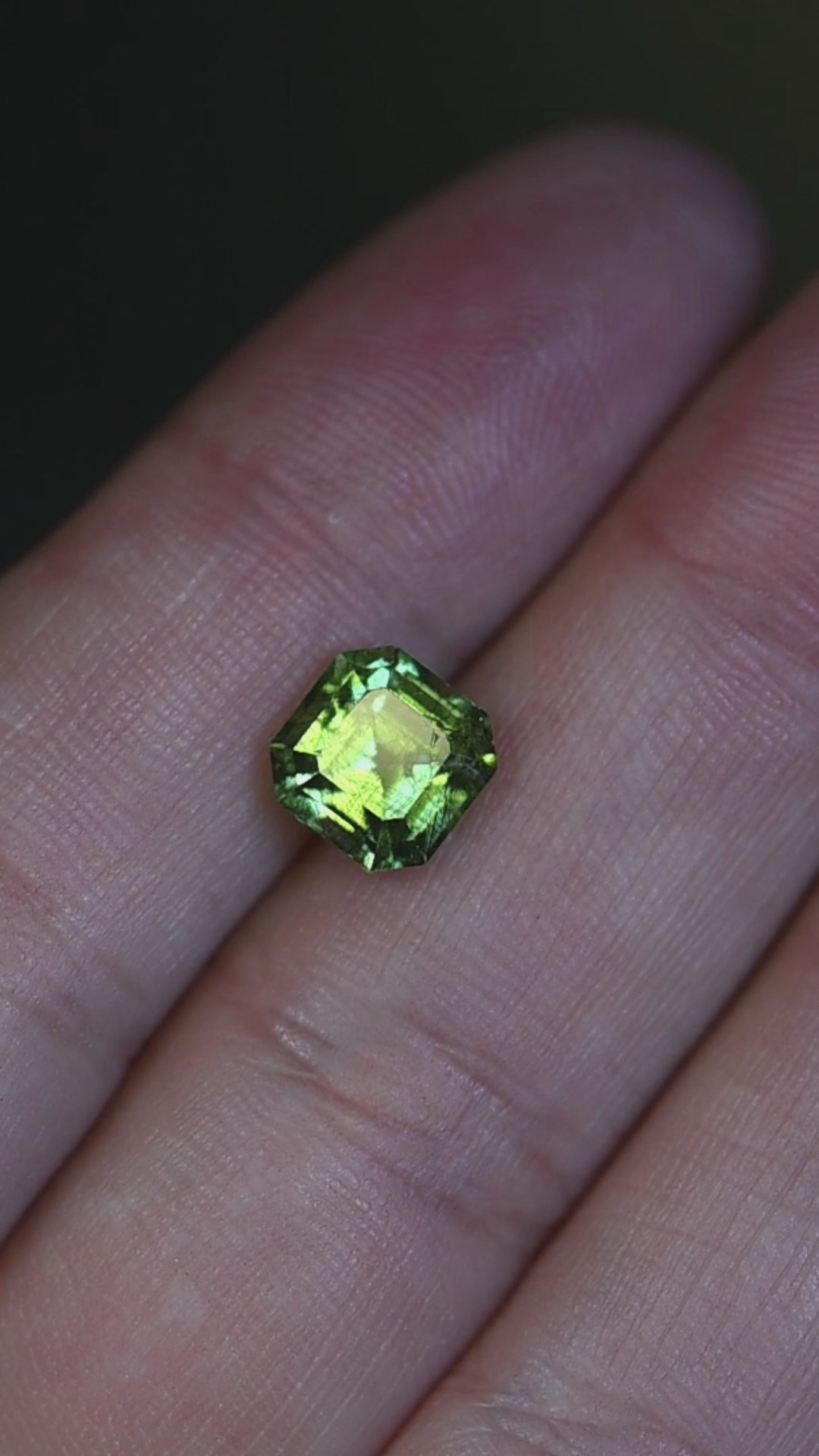Watch this untreated 2.81 carat Pakistani peridot rotate in natural light, revealing its vivid lime-green color, precision custom Asscher cut, and unique natural crystal inclusions.