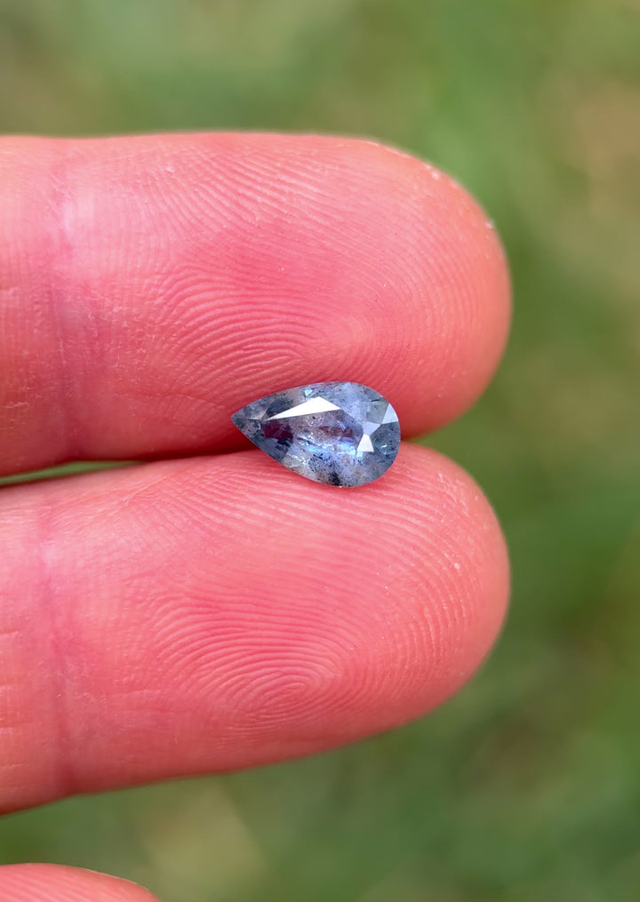 Daylight rotation video of 1.30CT pear mix cut sapphire from the Umba River Valley, Tanga, Tanzania, revealing its natural periwinkle blue hue and internal inclusions in motion, untreated and ethically sourced.